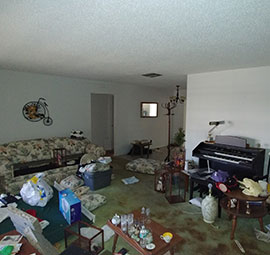 dirty and distressed living room of home prior to buying
